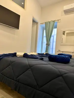 Letto o letti in una camera di Gloves Rooms