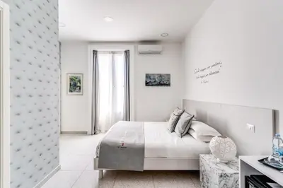 Letto o letti in una camera di Le Angioine Rooms
