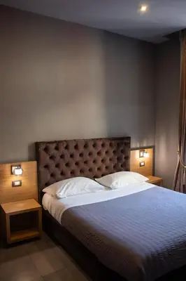 Letto o letti in una camera di BeB Umberto I Napoli