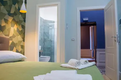 Letto o letti in una camera di WANDERLUST NAPLES a place to stay