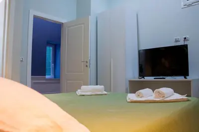 Letto o letti in una camera di WANDERLUST NAPLES a place to stay