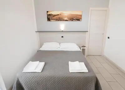 Letto o letti in una camera di B&B Solimena