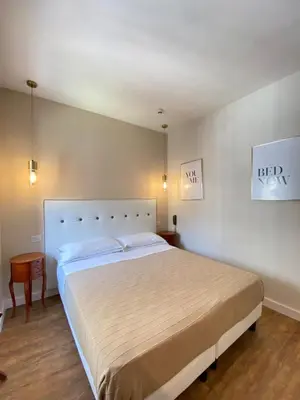 Letto o letti in una camera di Hotel Europeo Napoli