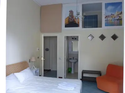 Letto o letti in una camera di BnB Naples