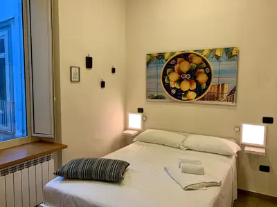 Letto o letti in una camera di BnB Naples