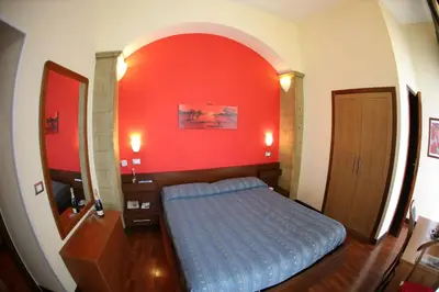 Letto o letti in una camera di Hotel Nettuno