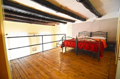 Letto o letti in una camera di Case Così Apartments - Napoli