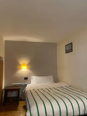 Letto o letti in una camera di Case Così Apartments - Napoli