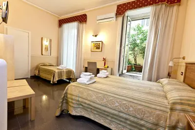 Letto o letti in una camera di B&B MediNaples