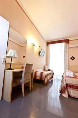 Letto o letti in una camera di B&B MediNaples