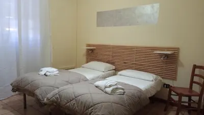 Letto o letti in una camera di Hotel Eliseo Napoli