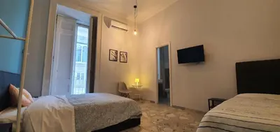 Letto o letti in una camera di Sofia Rooms