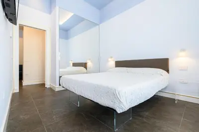 Letto o letti in una camera di Corso Umberto 58