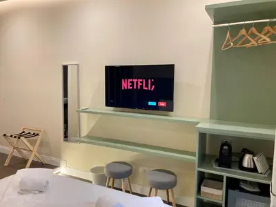 TV o dispositivi per l'intrattenimento presso South Hands Luxury Rooms