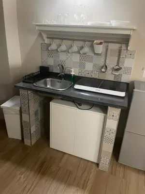 Cucina o angolo cottura di SOTTOSOPRA APARTMENT