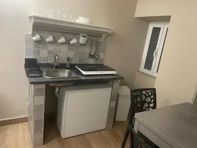 Cucina o angolo cottura di SOTTOSOPRA APARTMENT