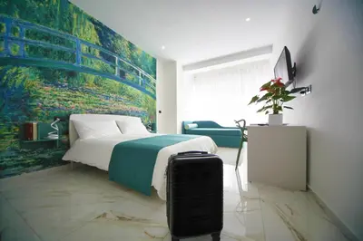 Letto o letti in una camera di Be Coloured - Boutique Art Rooms in Naples