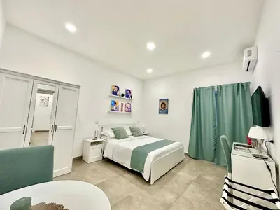 Letto o letti in una camera di Tribunali 181 Guest House