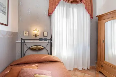 Letto o letti in una camera di Pinto-Storey Hotel