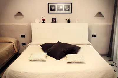 Letto o letti in una camera di Hotel Luna Rossa