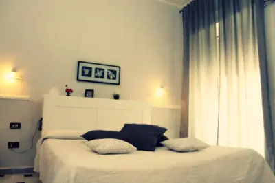 Letto o letti in una camera di Hotel Luna Rossa