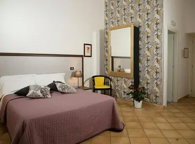 Letto o letti in una camera di Caravaggio Hotel