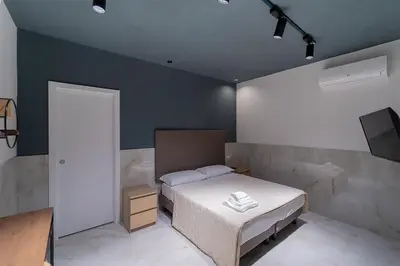 Letto o letti in una camera di P.C. Boutique H. Vesuvius, Napoli Centro, by ClaPa Group