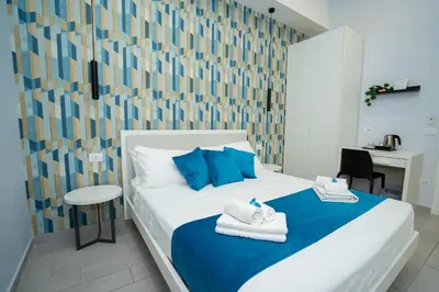 Letto o letti in una camera di Mida's Boutique Rooms