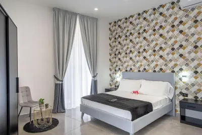 Letto o letti in una camera di Red Queen Naples