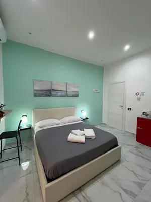 Letto o letti in una camera di InTarsia Rooms
