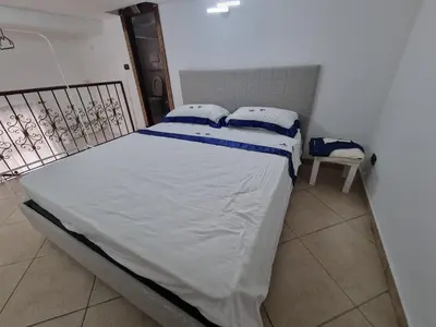 Letto o letti in una camera di B&b casa (le porte di napoli)