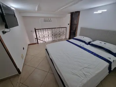 Letto o letti in una camera di B&b casa (le porte di napoli)