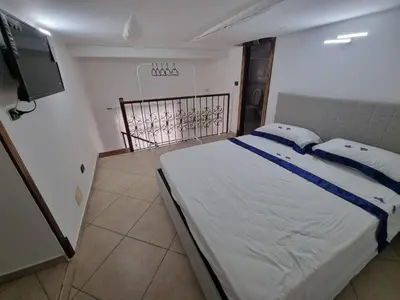 Letto o letti in una camera di B&b casa (le porte di napoli)