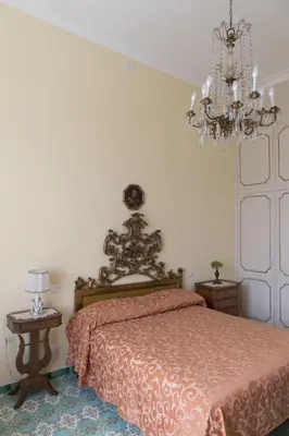 Letto o letti in una camera di Casa Bellevue