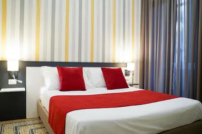 Letto o letti in una camera di Hotel Cimarosa