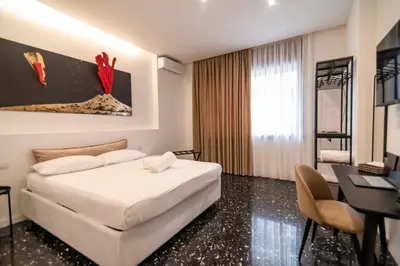 Letto o letti in una camera di La Hara Apartments