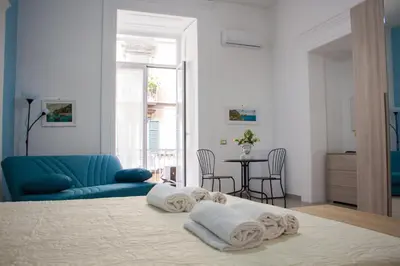 Letto o letti in una camera di Donna Laura Suite