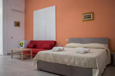 Letto o letti in una camera di Donna Laura Suite