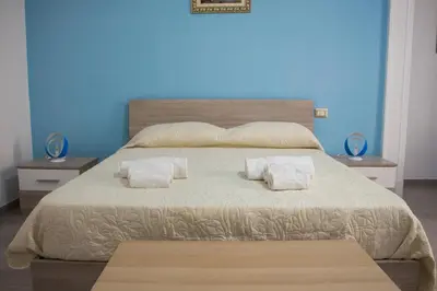 Letto o letti in una camera di Donna Laura Suite