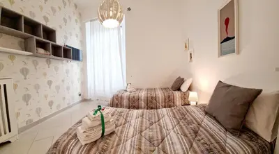 Letto o letti in una camera di LA GIOIOSA NAPLES INN