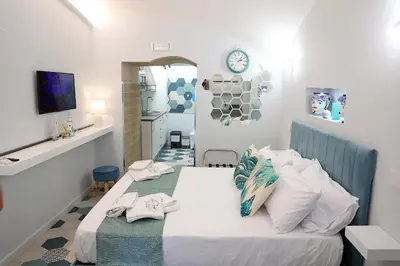 Letto o letti in una camera di Suite Na' poesia Mergellina