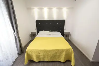 Letto o letti in una camera di Donna Luisa