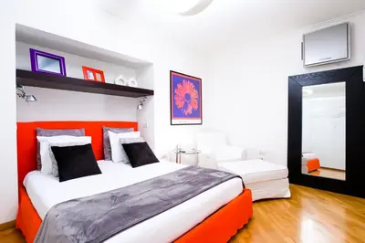 Letto o letti in una camera di Niparè Suite - Dimore Partenopee