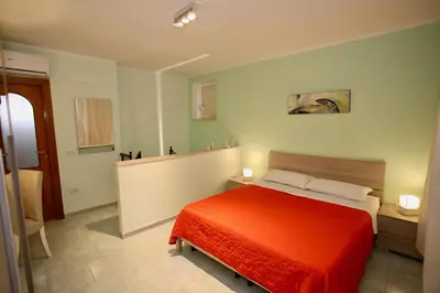 Letto o letti in una camera di La Terrazza di Napoli