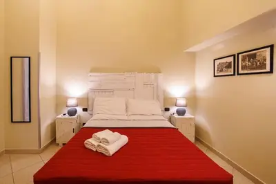 Letto o letti in una camera di The San Gregorio Armeno Apartment By HouseinNaples