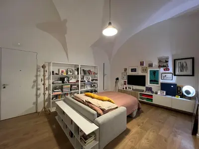 Letto o letti in una camera di La finestra su Chiaia
