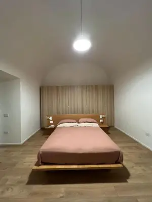 Letto o letti in una camera di La finestra su Chiaia