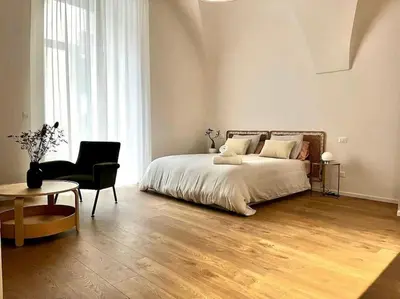 Letto o letti in una camera di La finestra su Chiaia