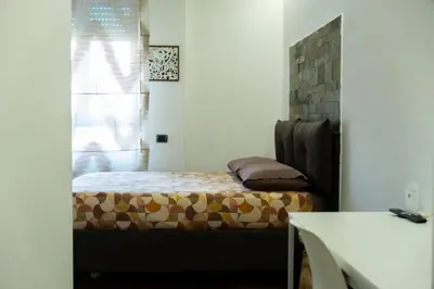 Letto o letti in una camera di ROOMITO apartments