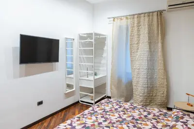 Letto o letti in una camera di ROOMITO apartments
